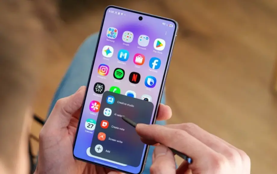Editorial illustration of a smartphone beside colourful software-update graphics