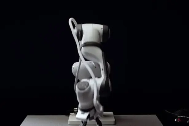 Robotic gripper handling an object using force-sensitive physical AI